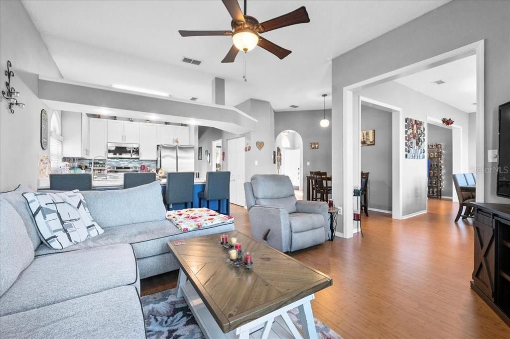 Ahhh, the Living Room! Relax in style in this open space with luxury solid bamboo flooring and a bright arched window.