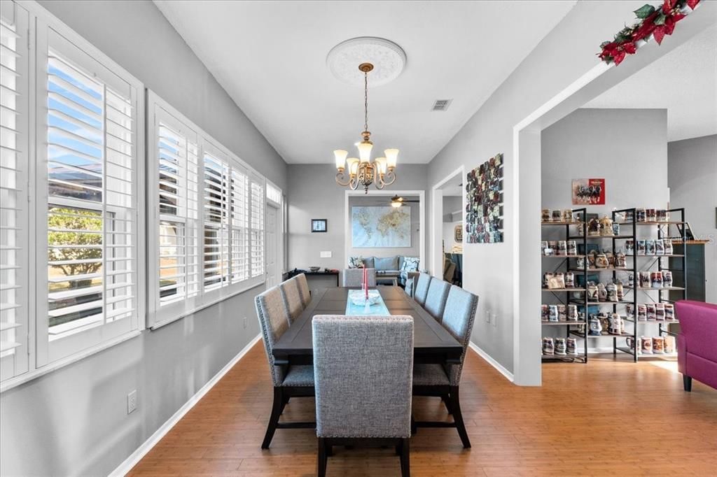 And in turn, the epic Dining Room with plantation shutters and a view of the tranquil back yard flows easily to the Sitting Room or the Living Room.