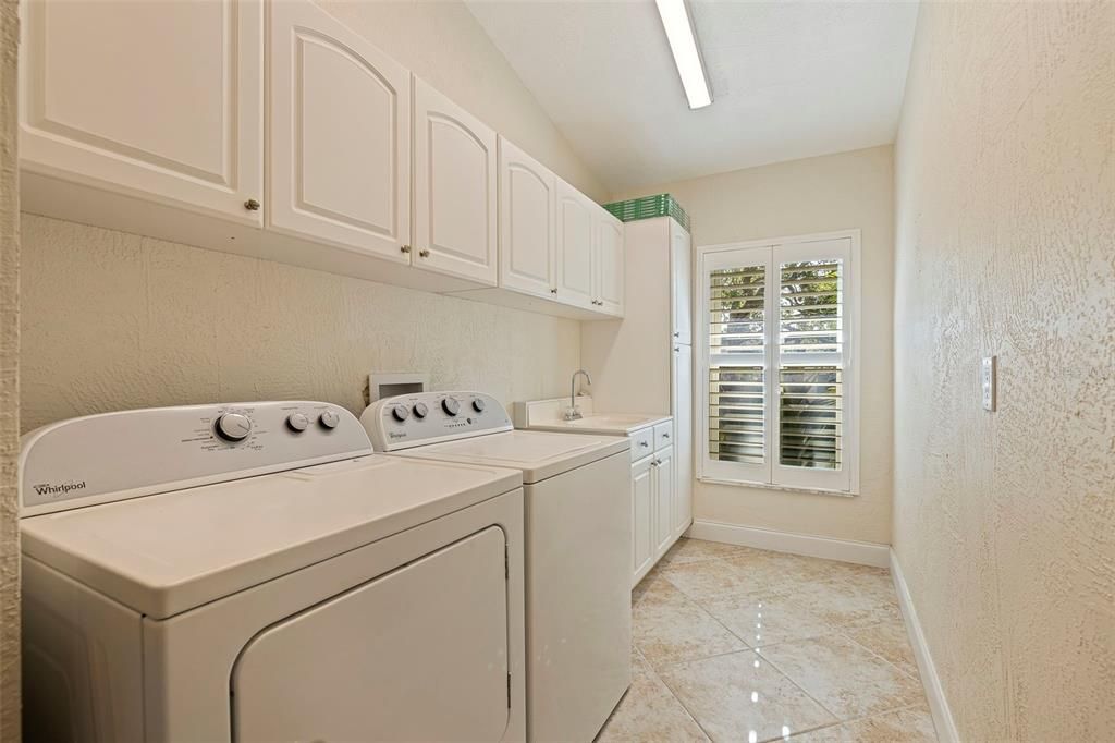 First floor laundry room with ample storage space