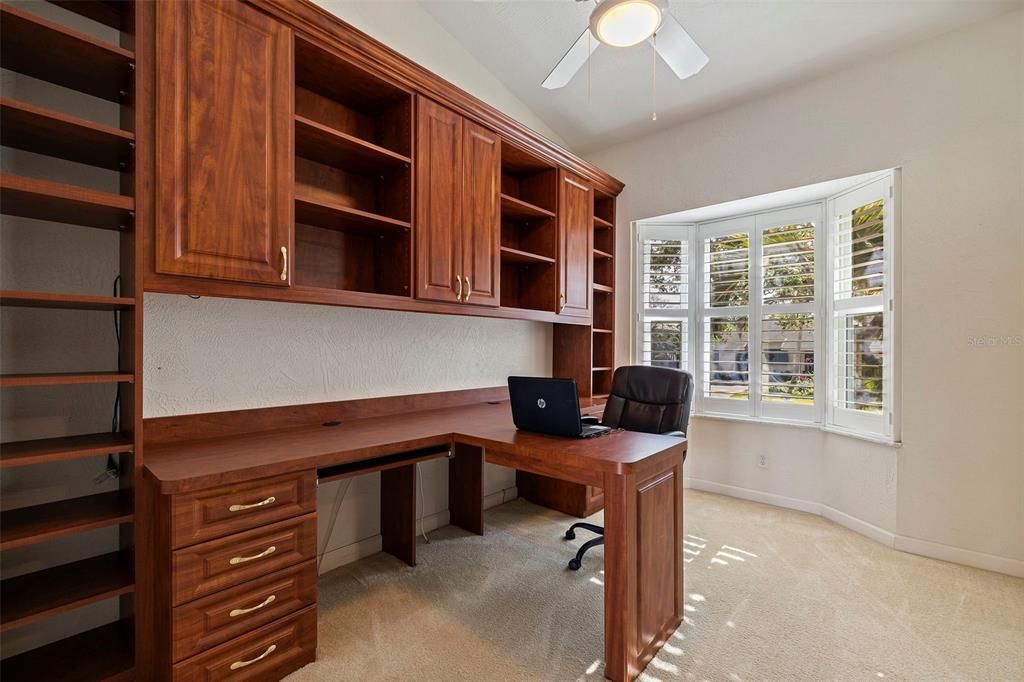 Office/den with built-ins and plantation shutters