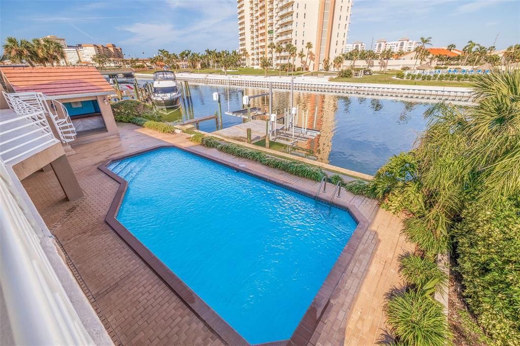 Sparkling pool and entertainment area with wooden cabana