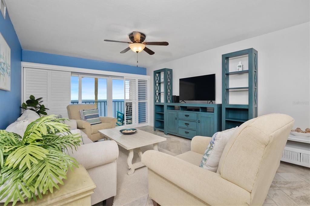 Living room with patio access and views of Tampa Bay.