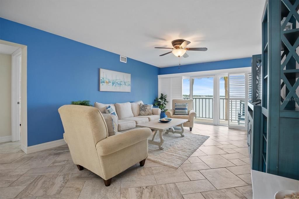 Living room with views of Tampa Bay and patio access