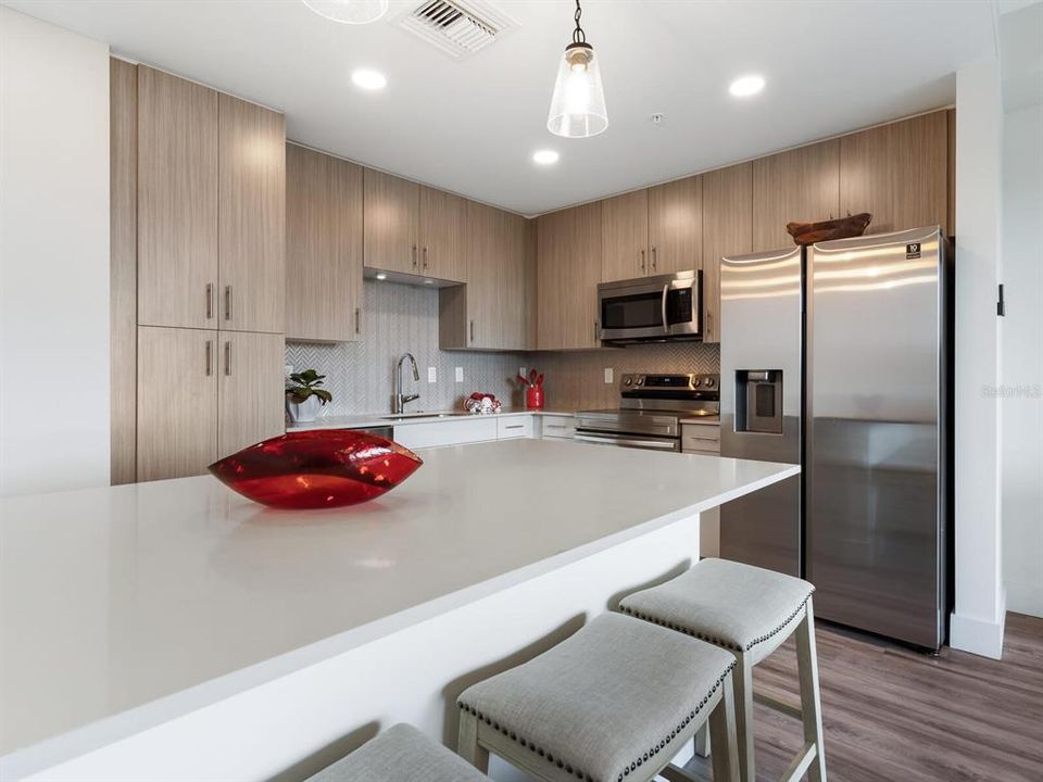 Spacious open kitchen living area as you look out onto your water views