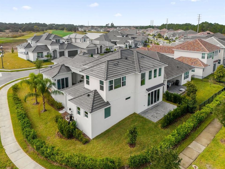 Aerial view of the property and the community