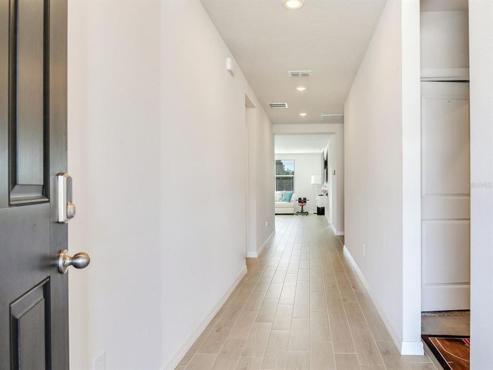 Foyer - wood look tile throughout