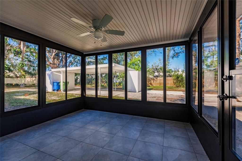 Updated Lanai Enclosure with view of Carport and Shed