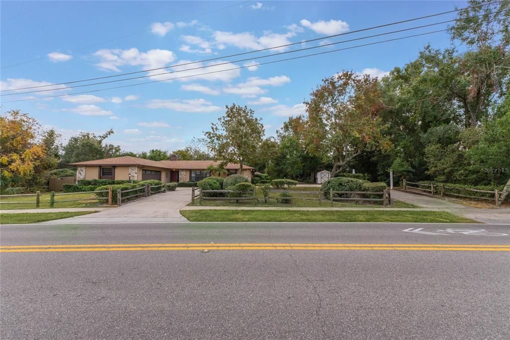 Street View, circular drive, property extends beyond the right side fence