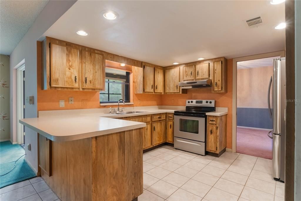 Kitchen with passtrhough to sunroom.  Taken from family room