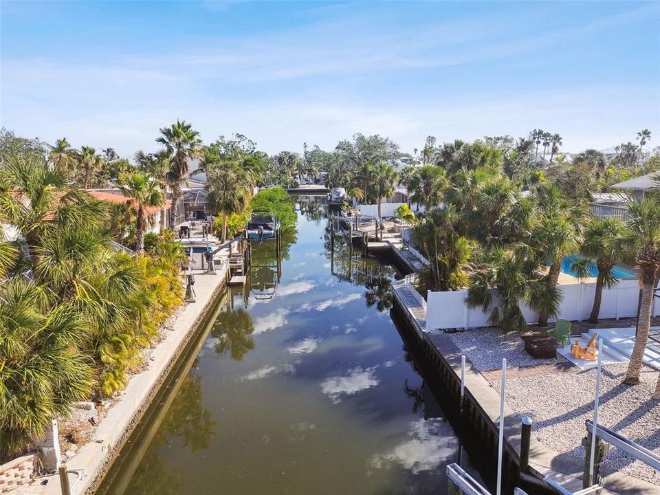 House is on the left.  You can see the davits on the seawall.