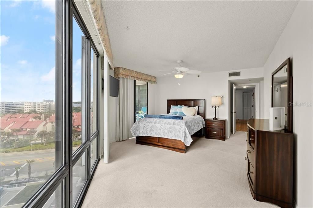 Extra large primary bedroom with ceiling fan