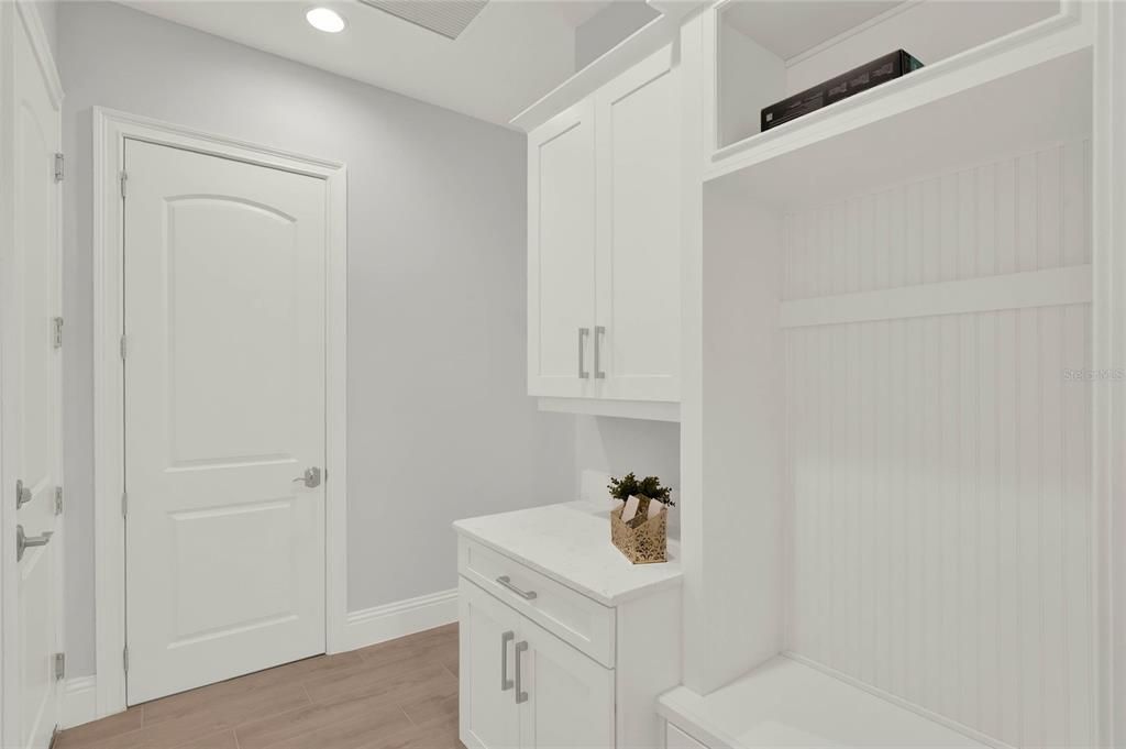 Mudroom with access to garage