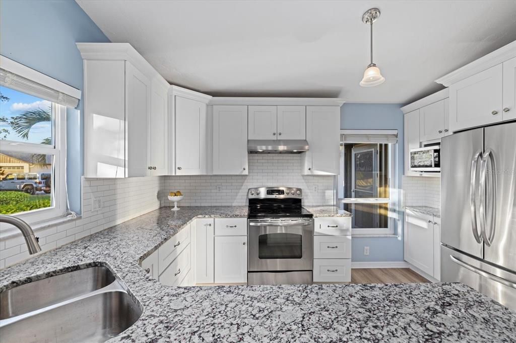 Kitchen with SS appliances and granite counter tops