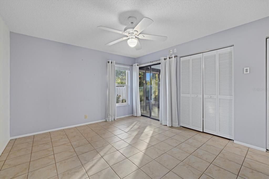 Primary Bedroom with sliding glass doors to the Florida Room