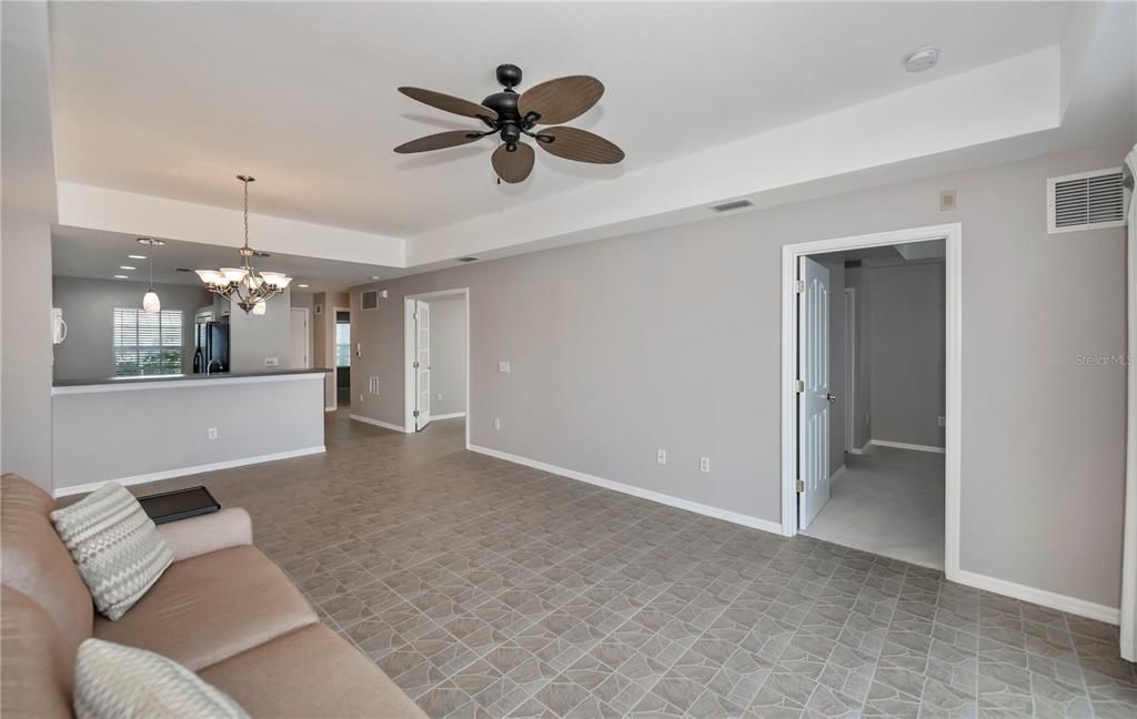 volume ceiling with tray ceiling in this open floor plan home