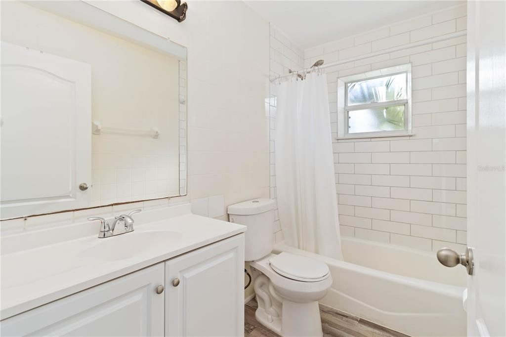 Guest Bathroom with nice subway tile to the ceiling