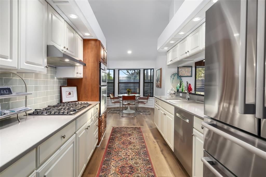 Kitchen features quartz countertops and new Bosch (smart) appliances