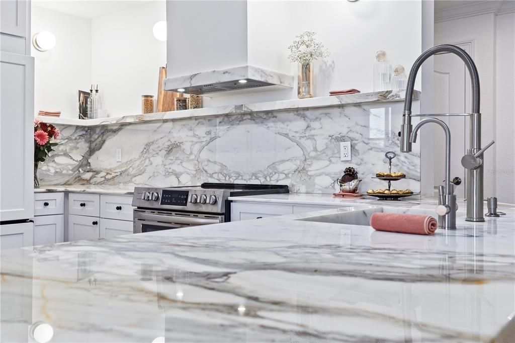 Gorgeous marble counters and backsplash