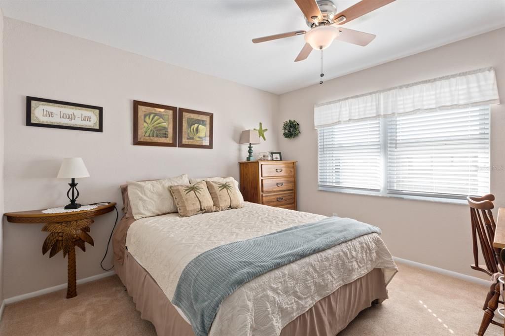 Guest bedroom located at the front of the unit and also has walk-in closet