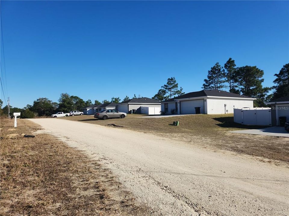 The gray house is no the far right and the next several house are all new in the past few years.