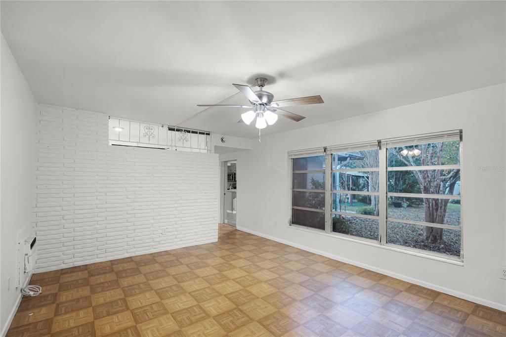 primary bedroom with large window facing garden