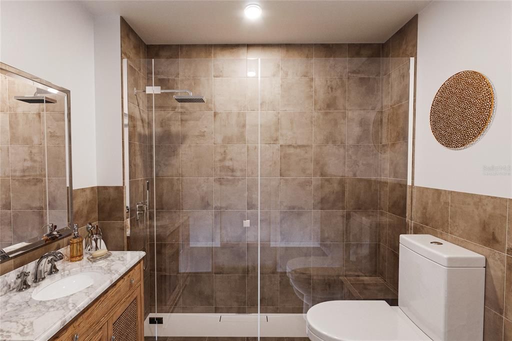 Virtually staged picture.  This is an example of what the walk-in closet with the washer and dryer could look like if you wanted to add a second bath in the primary bedroom.