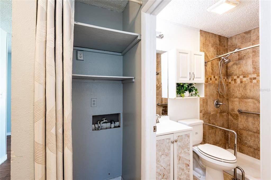 Washer and dryer closet located next to the main bath.