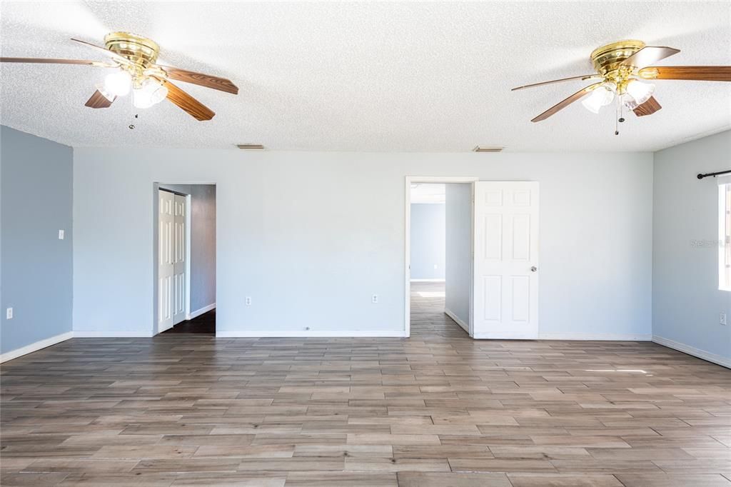 The door opening on the left leads to the office/den.  A barn door could be added to close off the office.