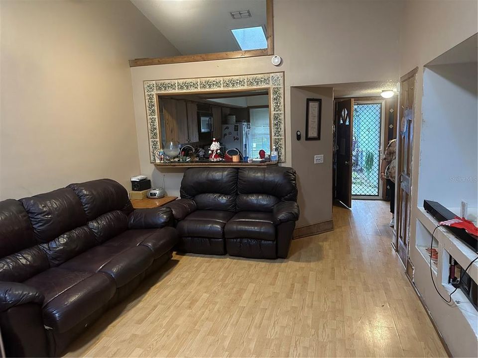 Living room/Dining Room with Kitchen/Front Door View