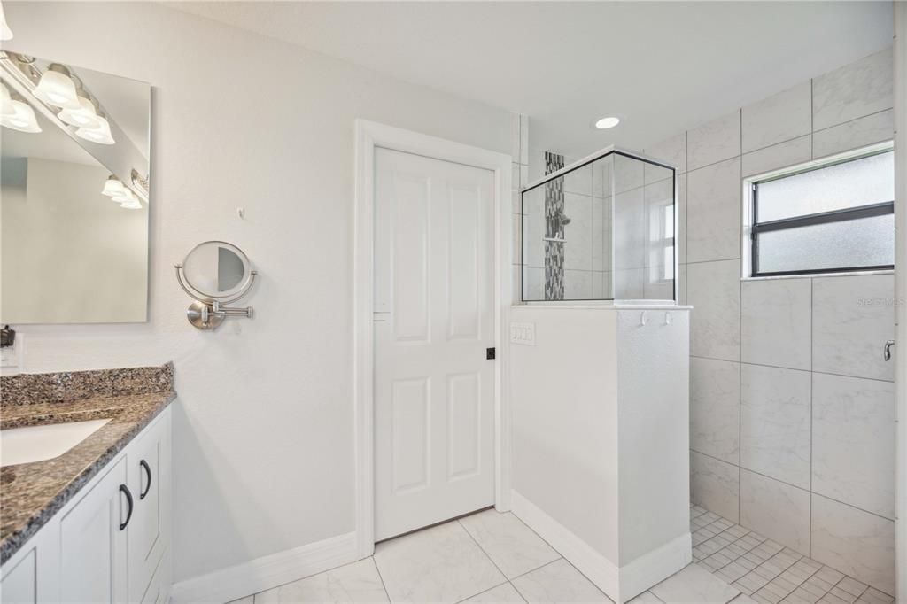 Step in shower with waterfall tile feature