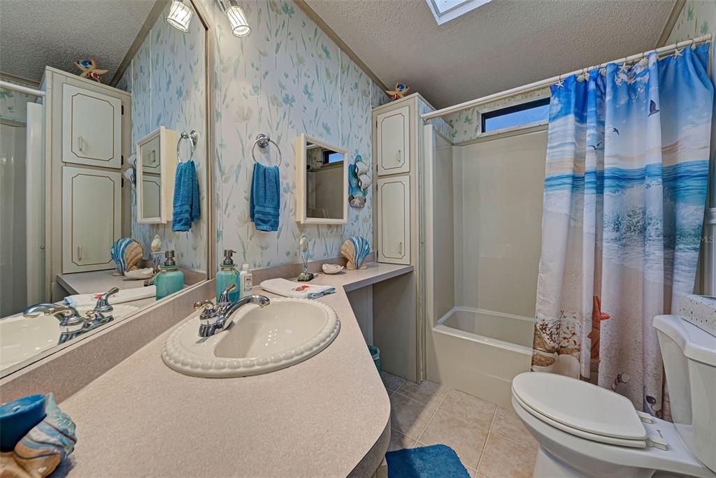 GUEST BATHROOM - TUB SHOWER COMBINATION.