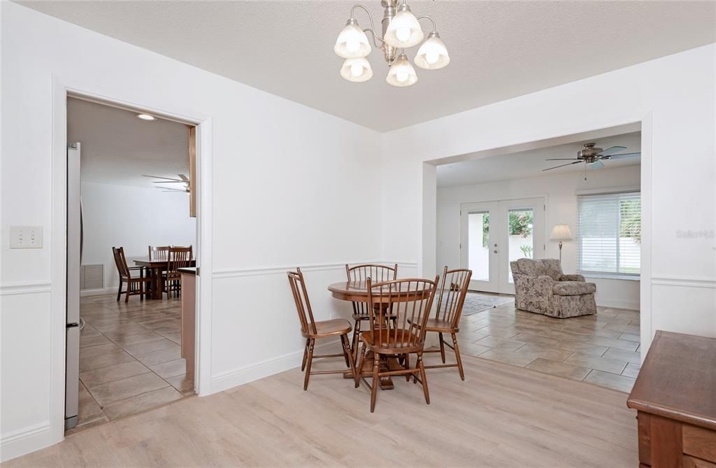 View of dining room though kitchen and family room