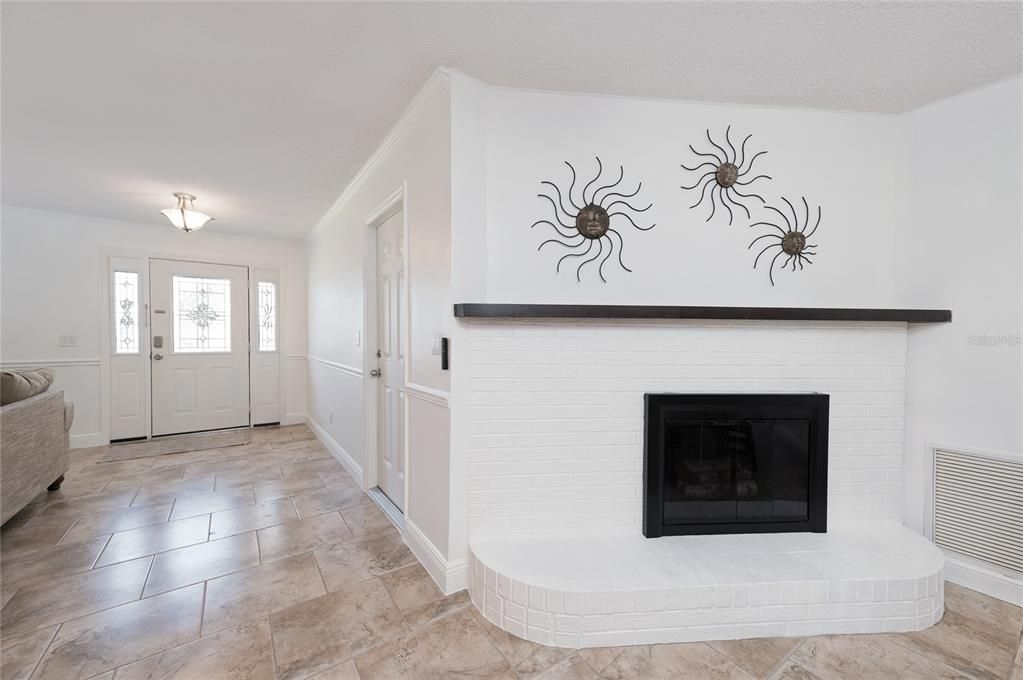 Wood burning fireplace in eat in kitchen area