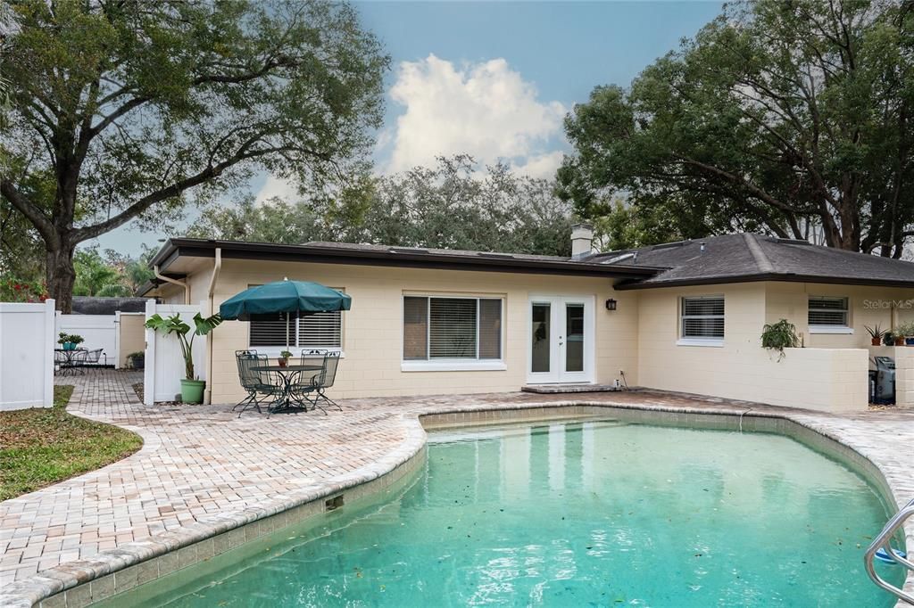 View from end of pool to the family room backyard access through French doors.