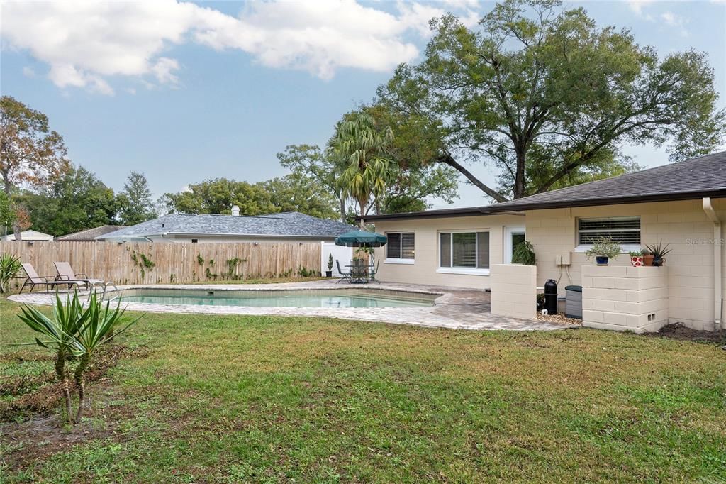 Backyard and pool from side of yard