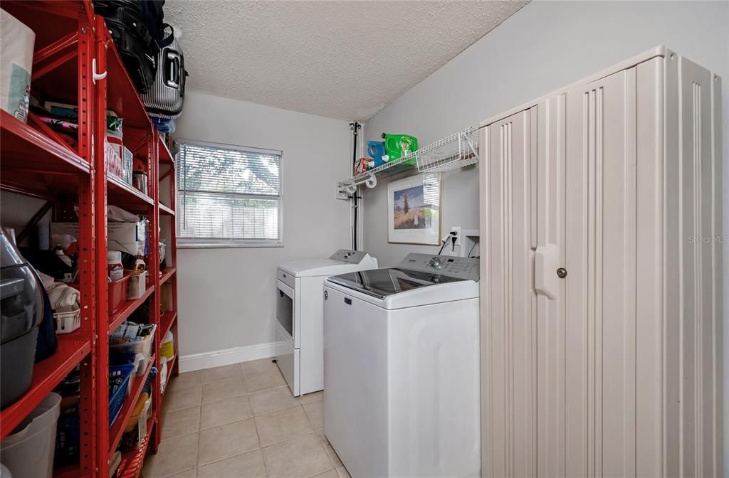 Laundry room is accessed through the garage, lots of storage!