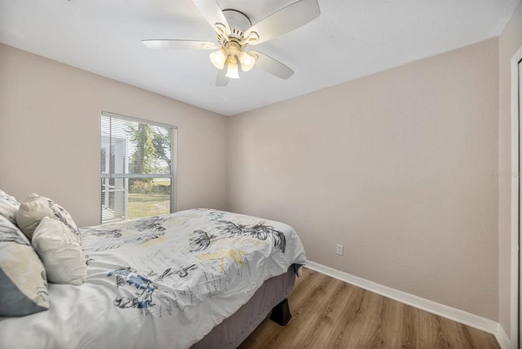 Guest bedroom at the back of the home - opposite side of the primary for privacy