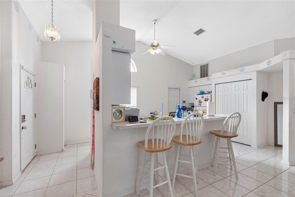 vaulted ceilings & view into kitchen