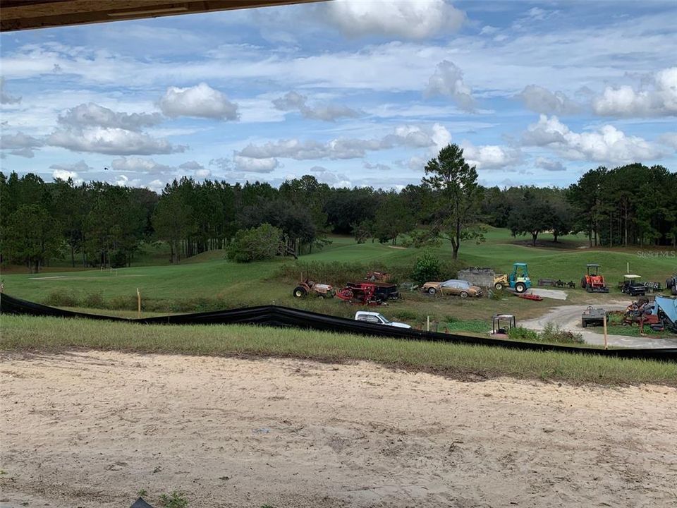 putting green at entrance to community