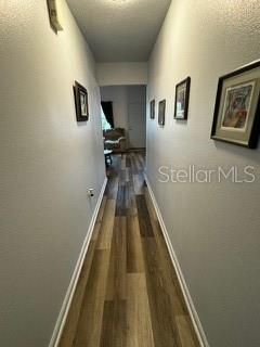 Hallway to the bedrooms, bath, laundry closet, workshop and lani