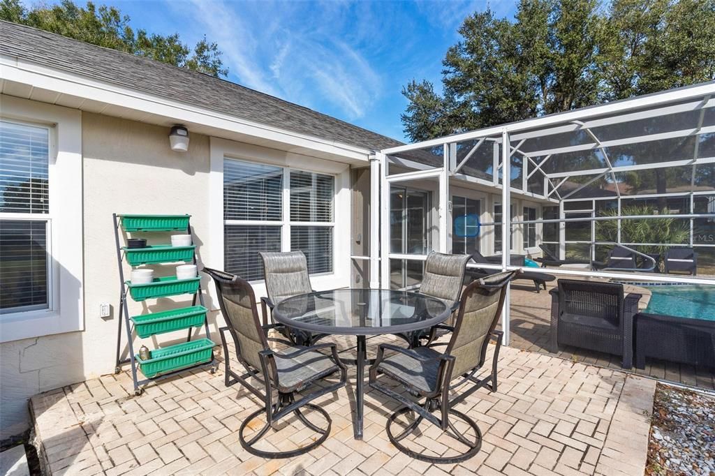 Brick paver patio with views of golf course