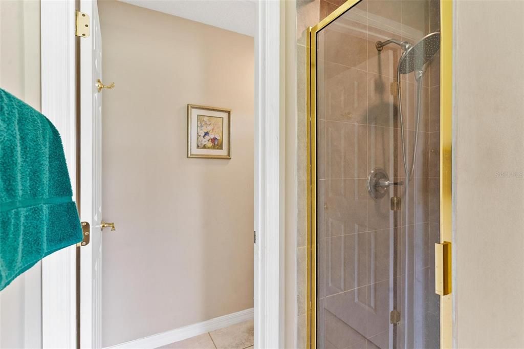 Primary bathroom features double vanity sinks, jacuzzi tub, walk in shower, and walk in closet.