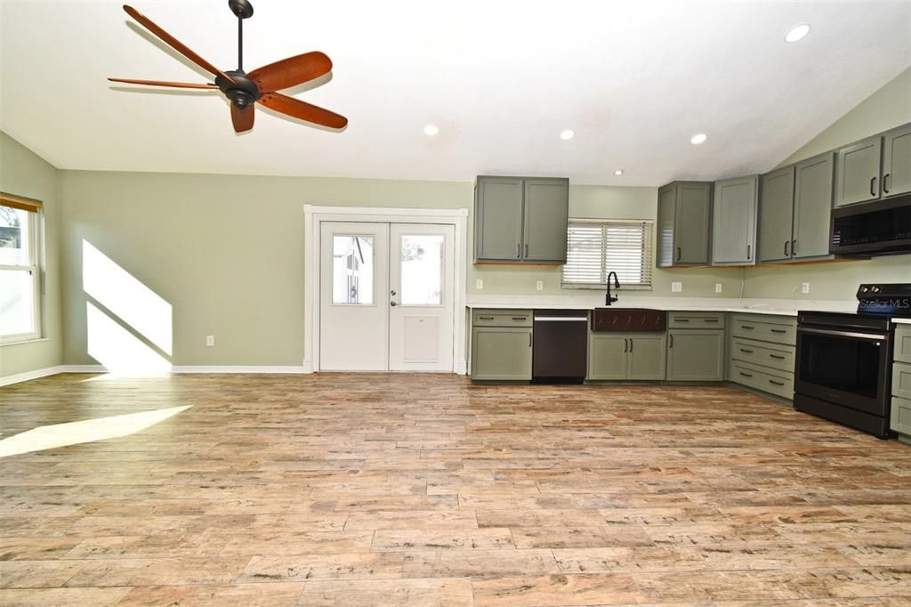 Kitchen w/ custom solid wood cabinets, quartz and stainless