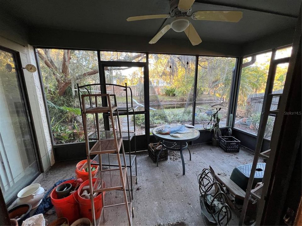 Screened in patio at back of home