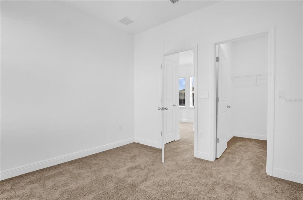 Bedroom with walk in closet