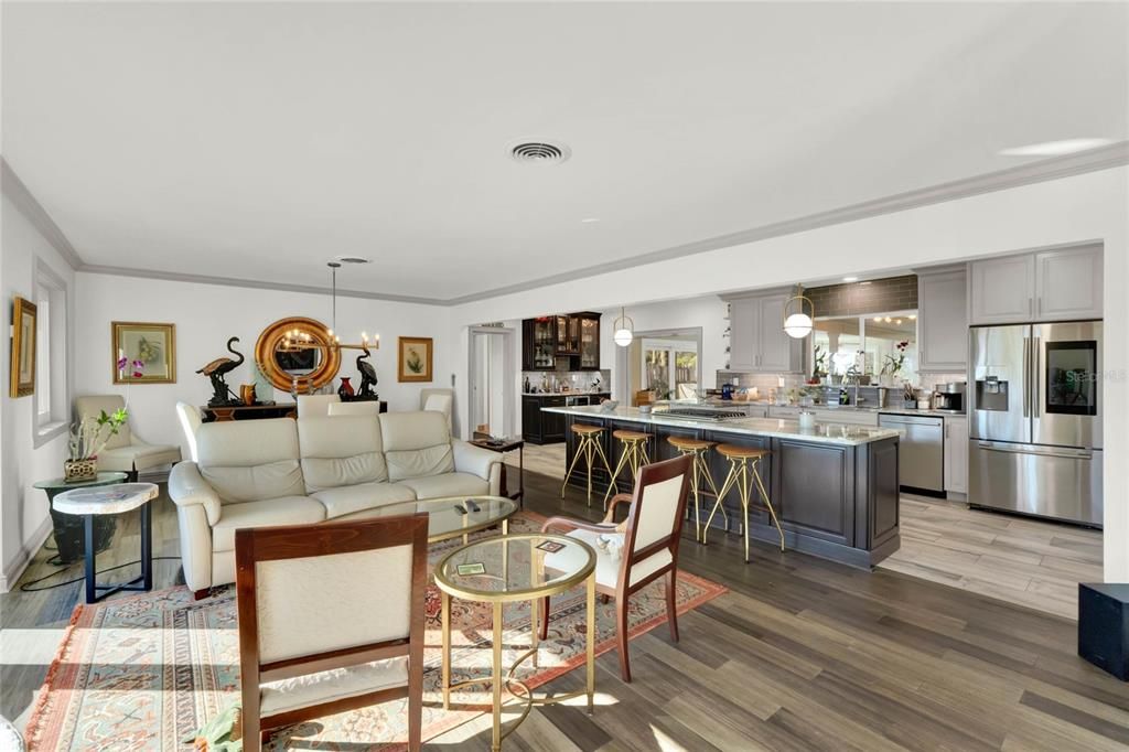 OPEN ROOM VIEW OF KITCHEN WITH LAKE VIEW