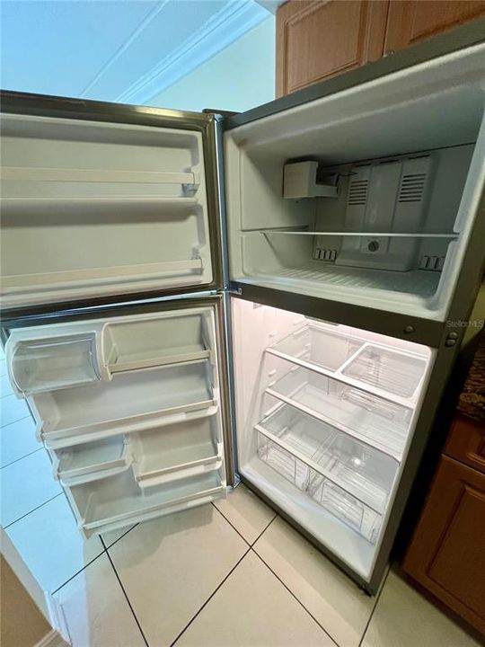 Stainless steel appliances in galley style kitchen