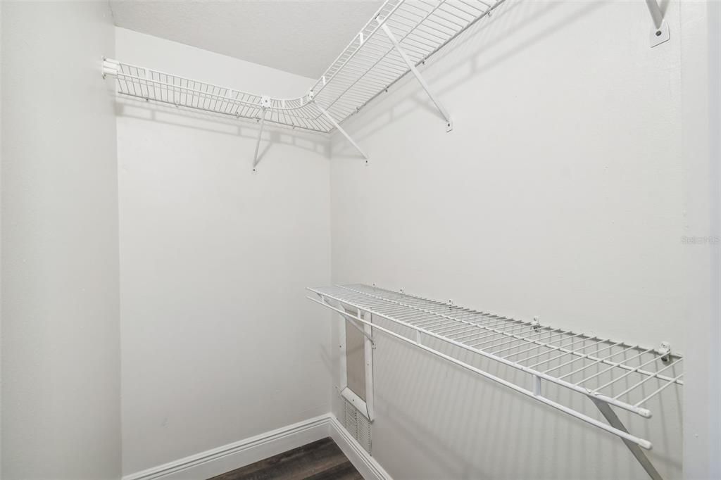 Spacious Walk-in Closet with shelving in Primary Bedroom