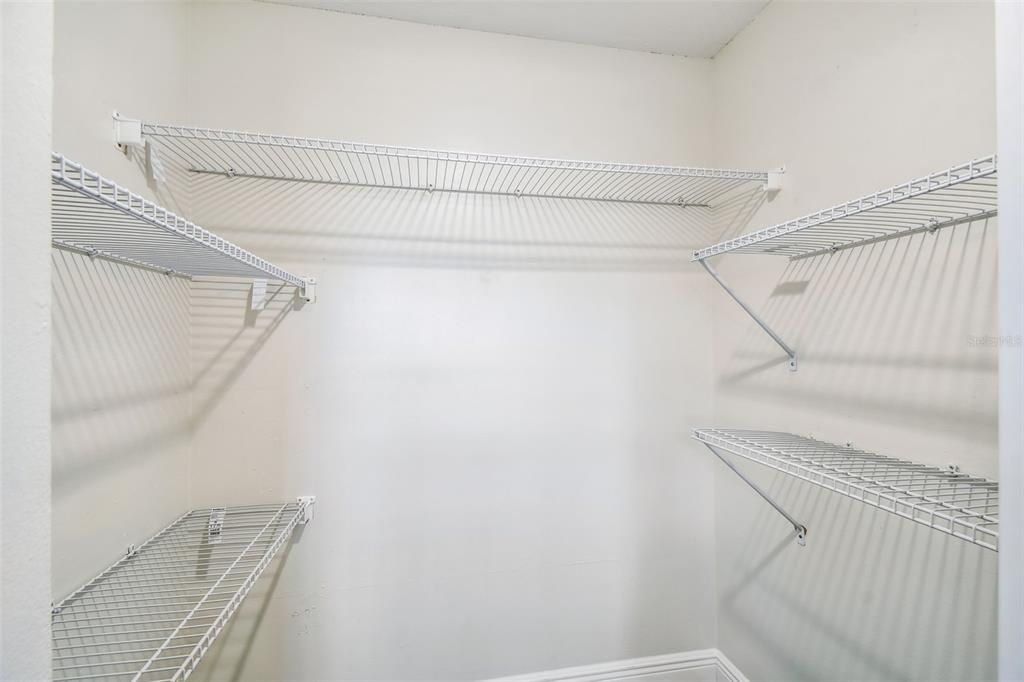 Large Closet with storage shelving in Bedroom 2