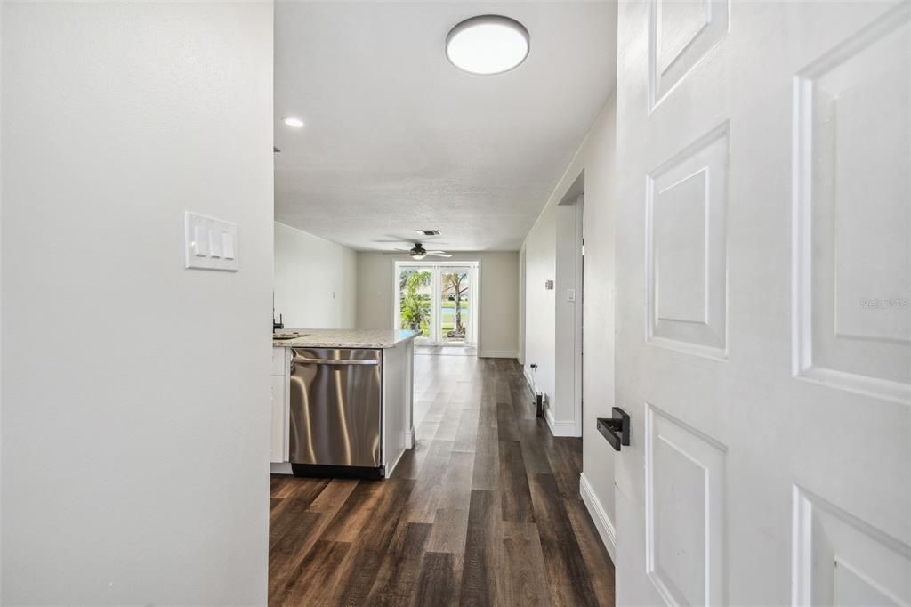 NEW LUXURY VINYL PLANK FLOORING THROUGHOUT, NEW KITCHEN WITH MODERN CABINETRY+HARDWARE, QUARTZ COUNTERTOPS, SS APPLIANCES, ADDITIONAL DRY GOODS PANTRY, LED LIGHTING, NEW HVAC, FRESHLY PAINTED INTERIOR.